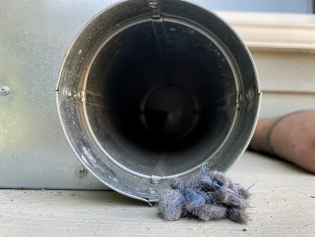 Colton Dryer Vent Cleaning technician using specialized equipment to clear severe dryer vent blockage in Colton